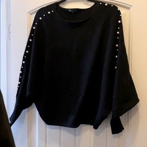 Sweater with pearls on sleeve